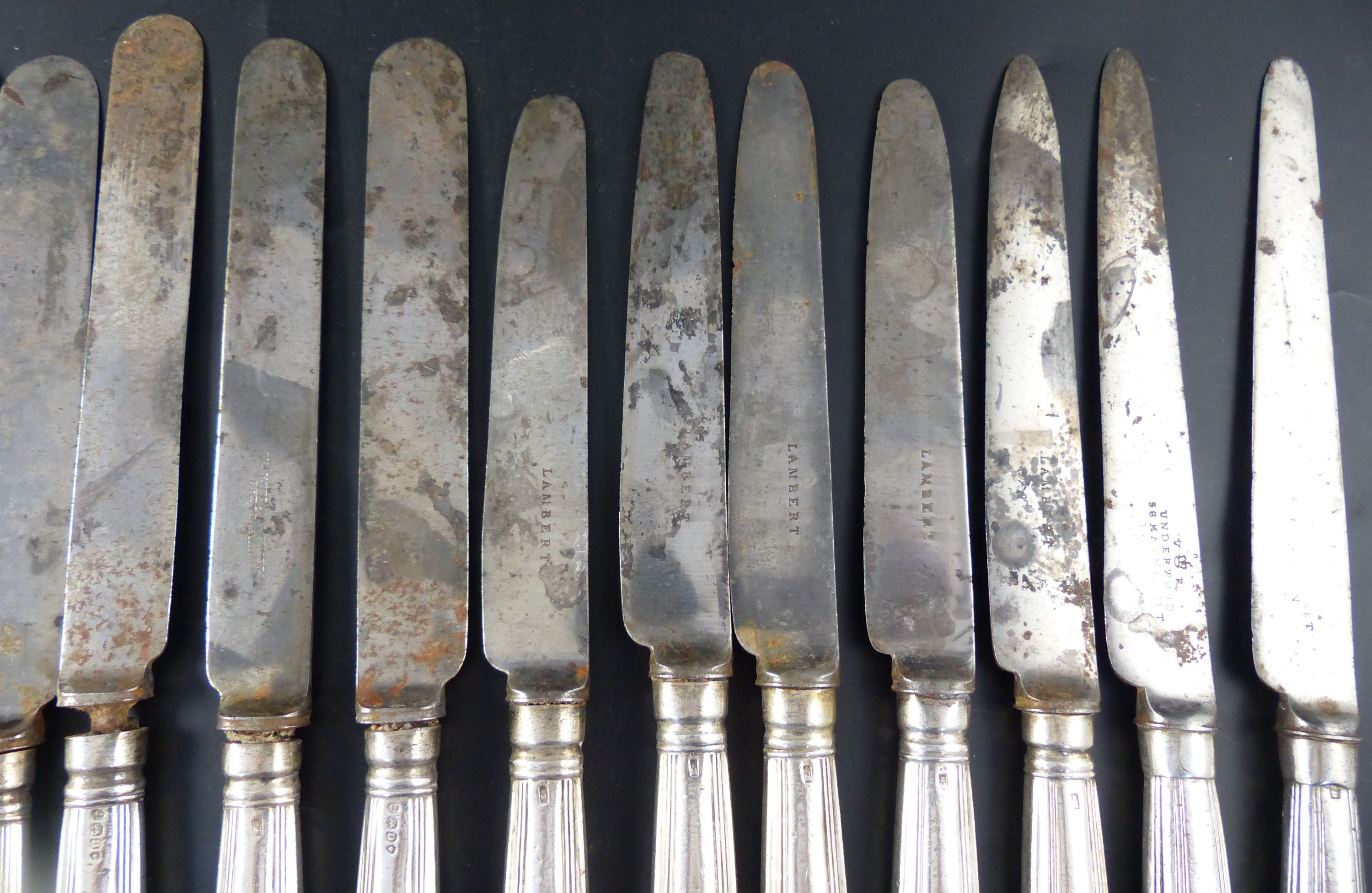 A set of twelve George IV silver handled thread pattern table knives,
